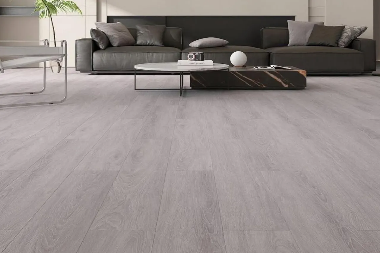 Grey laminate flooring installation in a modern living room